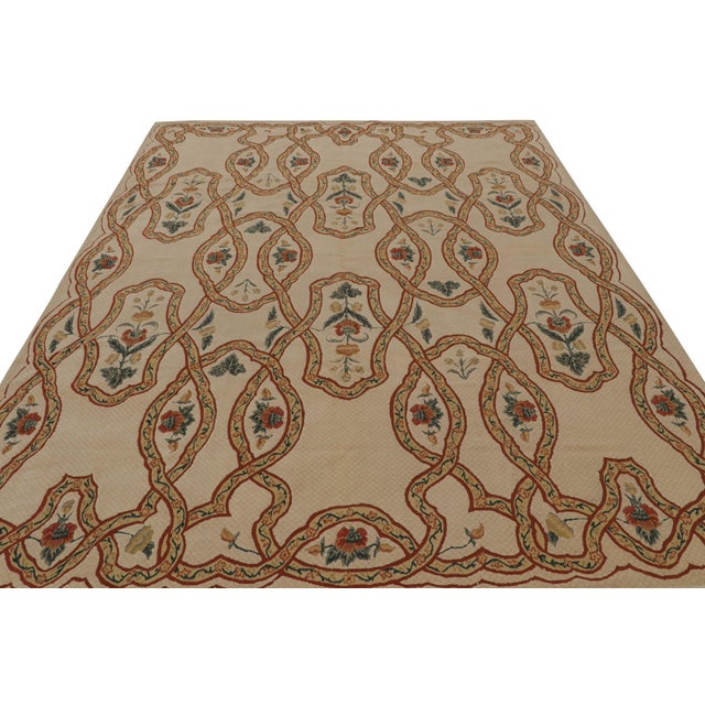 Hand-knotted in wool, this 8x11 European rug in beige features Trellises with floral patterns within in green and red...
