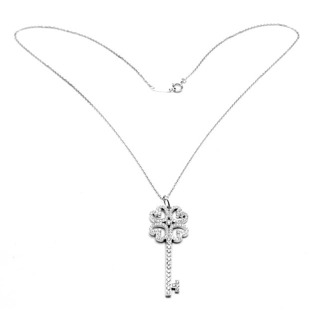 Edit Late 20th Century Tiffany & Co. Platinum & White Gold Enchant Quatra Heart Key Pendant Necklace For Sale In Philadelphia - Image 6 of 11