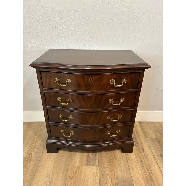 Classic Chippendale-style chests featuring a beautiful serpentine front with stunning flame mahogany veneer and original...