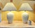 A beautifully preserved pair of vintage white ceramic table lamps featuring striking Art Deco–style vertical fluting that...