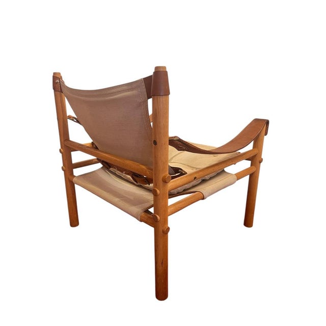 Sirocco armchair by Arne Norell, designed in the 1960s. Solid oak frame, leather and linen canvas. Very good condition. I...