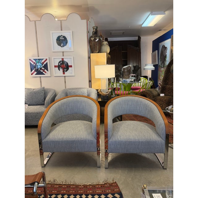 Pair of gorgeous custom Italian solid polished stainless steel and curved teak wood club or tub chairs designed and...