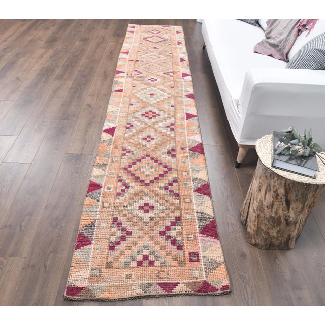 Vintage Turkish Hand-Knotted Herki Runner Rug is a semi-Vintage rug. '60s Eastern region of Turkey's unique rug is...