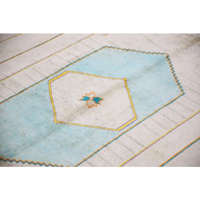 Introducing a one-of-a-kind vintage Turkish hand-knotted wool rug, carefully crafted by skilled artisans using traditional...