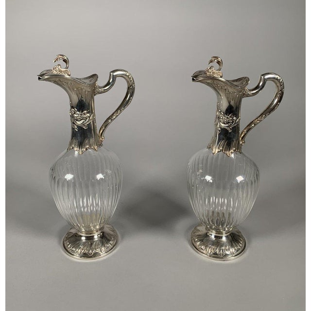 Pair of 19th Century Rococo Crystal and Silver Ewers. Solid silver (950), vermeil interior . Total weight: 1411g. French...