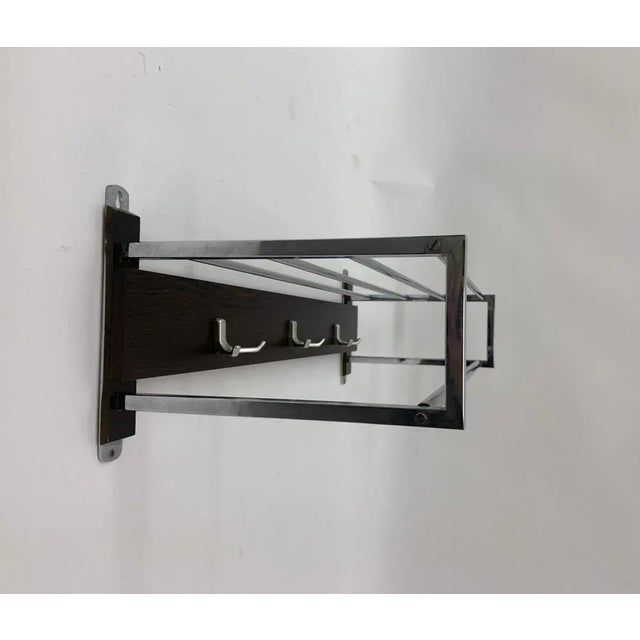 Dimensions: 80,5cm W, 26cm H, 32,5cmD Condition: Good Material: Wood, chrome Period: 1970's.