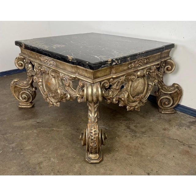 A highly sculptural Baroque Revival coffee table by Brustlin Workshop of Los Angeles, renowned for their fine artisan...