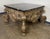 A highly sculptural Baroque Revival coffee table by Brustlin Workshop of Los Angeles, renowned for their fine artisan...