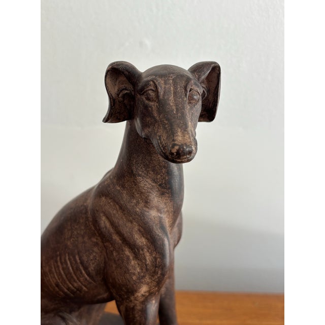 Stately English whippet or greyhound statue stands 9" tall and fits on most bookshelves. Though made of lightweight resin,...