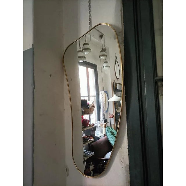 Mirror with Brass Frame in the Shape of a Banana, in Flawless conditions. Designed from 2000 I have official proof of...