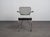 A distinctive dutch modernist armchair produced by ahrend de cirkel in the 1960s. The design combines a chromed tubular...