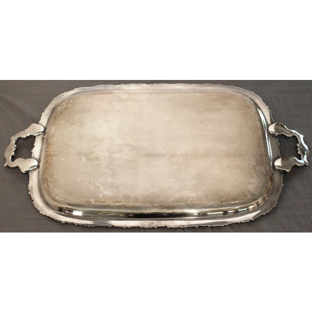 Circa 1930s silver plated tea tray by International. Handsomely decorated with swags of fruits & flowers decoration,...