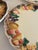 A set of 6 dessert plates by Lefton, each featuring a dimensional majolica-style border of pineapples, grapes, pears, and...