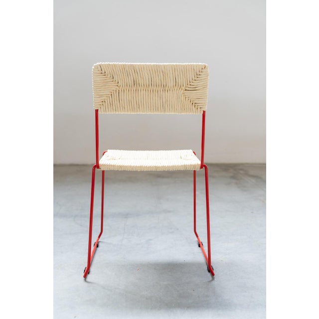 New chairs, still in box, in curved iron painted red. producer: sintesi the seat and backrest are hand-woven on the...