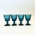 A set of 4 vintage goblets in an ornate design in blue colored glass. Made in the "Park Lane" pattern by Colony Glass, a...