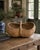 A generously scaled early 20th-century American gathering basket, handwoven from oak splints in the traditional buttocks...