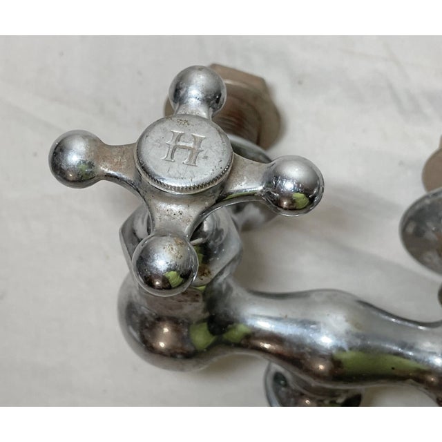 This antique wall faucet fixture is a wonderful piece that will add a touch of sophistication to any space. Crafted from a...