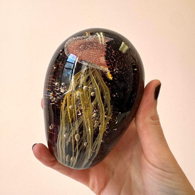 A wonderful, highly detailed, glass jellyfish paperweight. The yellow and red jellyfish swirls amongst the bubbles, with a...
