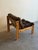 Striking Brutalist lounge chair featuring a bold solid wood frame and generously padded corduroy cushions. The chair has a...