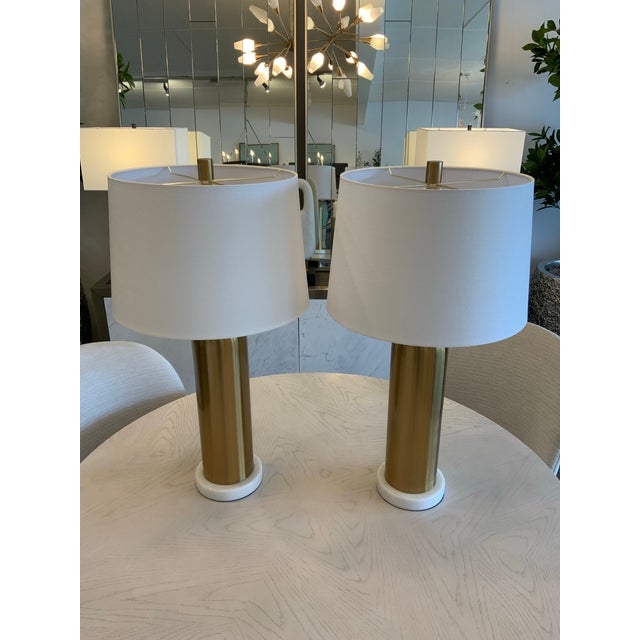 Modern glam style meets sleek midcentury design in the Elishaw Table Lamp. This metal design features a luxe aged brass...