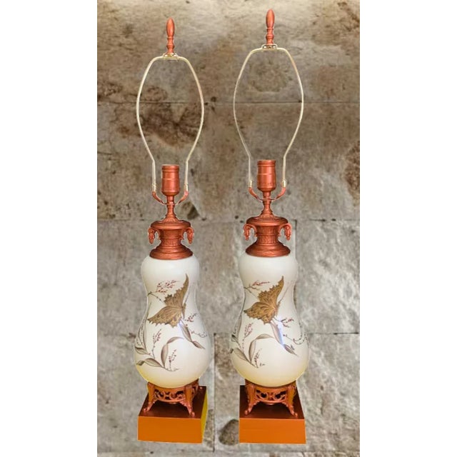 This exquisite mid-century table lamp showcases a gracefully hourglass-shaped white ceramic body, adorned with delicate...