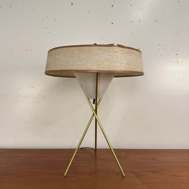 This is a “Tripod” table lamp designed by Gerald Thurston for Lightolier circa 1950s. It has beautiful, brass tripod legs,...