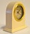 1995 South Pacific, beige-colored Desk or Mantel clock with a gold Brass rim and Roman numeral dial, featuring the...