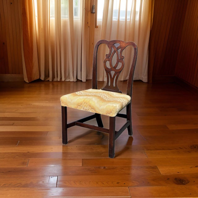 Introducing an elegant Antique Chippendale Mahogany Side Chair with an Arched Crest Rail and Pierced Splat, a timeless...