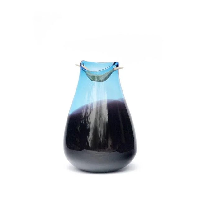 Blue and topaz Heiki vase, Pia Wüstenberg Dimensions: D 20-22 x H 32-40 Materials: glass, wood, metal wire Available in...