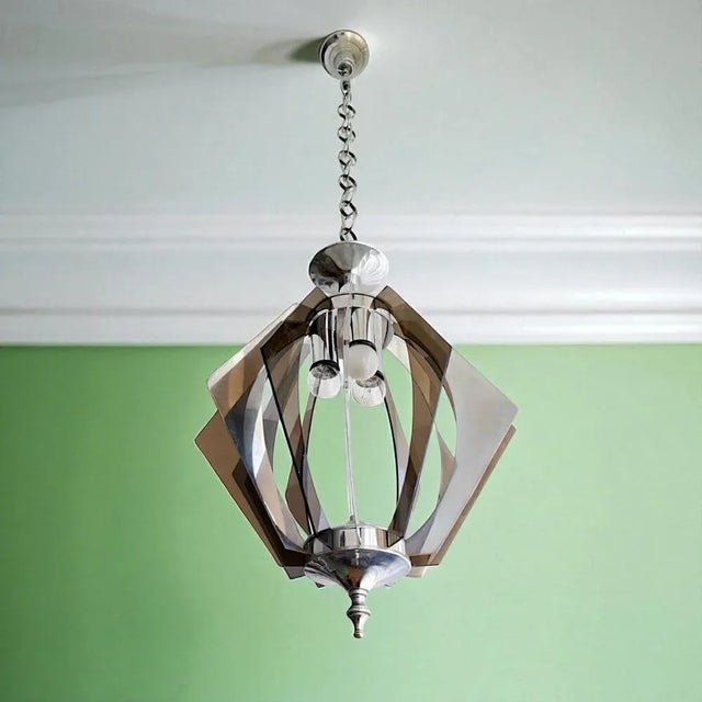 Modern chandelier, made in the 1980s. It is made of beige smoked acrylic glass and clear acrylic glass sheets, which are...