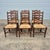 This is a set of 6 ladder back rush seat dining chairs from Theodore Alexander's 2019 Castle Bromwich Collection. The...