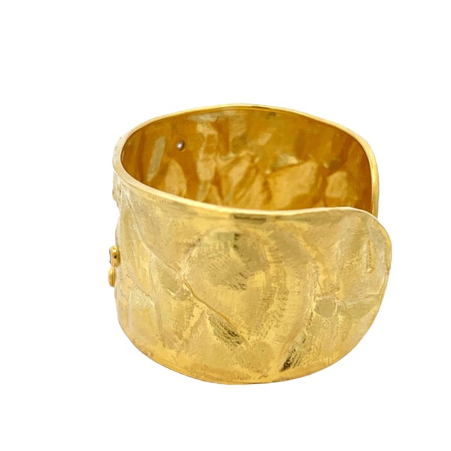 A beautiful vintage Italian cuff bracelet crafted in solid 18 karat yellow gold, designed with a richly textured...