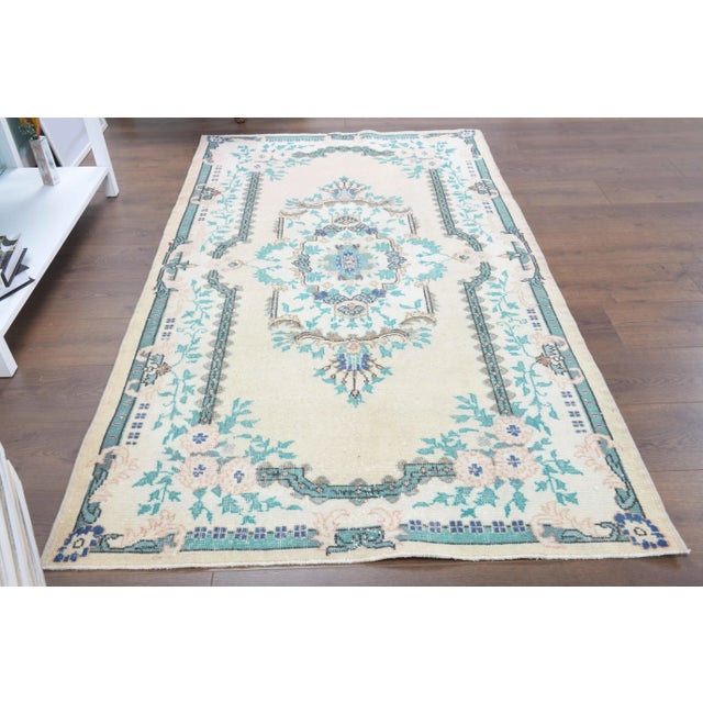 Vintage Turkish Hand-Knotted vintage rug is a semi-antique vintage area rug.'70s Eastern region of Turkey's unique rug is...