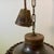 rare, '70s-era perforated stoneware pendant in a brown glossy glaze by ceramist Aksel Larsen for AXELLA STENTØJ. It hangs...