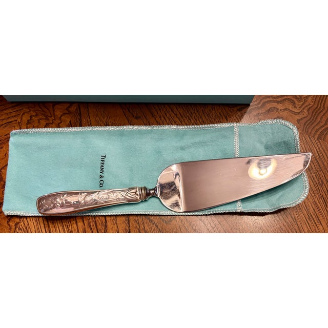 Beautiful Tiffany Cake or Pie server. In the original box and with protective felt bag. Intricate bird and vine pattern on...