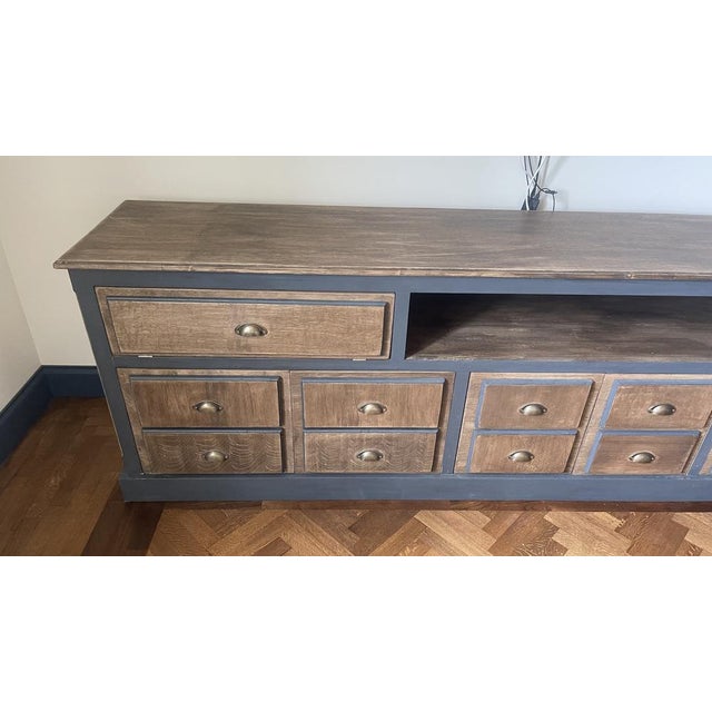 Bank from the 60s shop in solid oak, it has two foldable doors and six opening doors to compass, the furniture is...