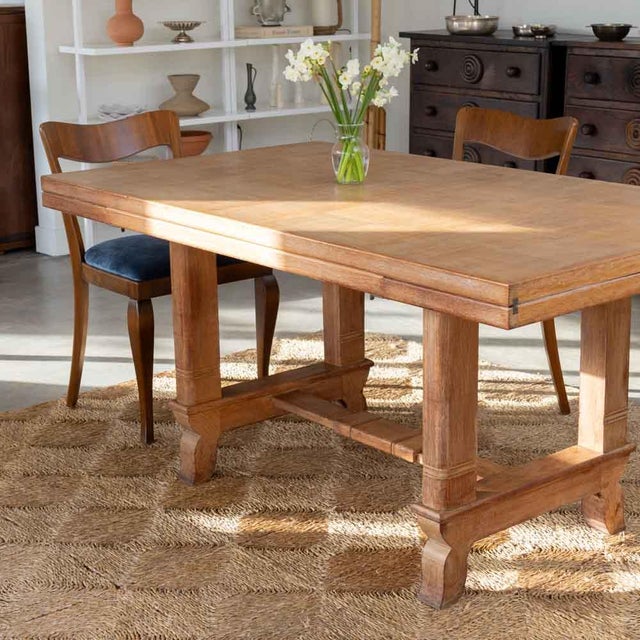 Incredible wood dining table by Charles Dudouyt, made in France, 1940s. Large rectangular parquet top with carved wood...