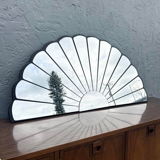 A striking vintage Art Deco sculpted fan mirror, embodying the era’s fascination with symmetry, geometry, and glamour. The...