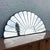 A striking vintage Art Deco sculpted fan mirror, embodying the era’s fascination with symmetry, geometry, and glamour. The...