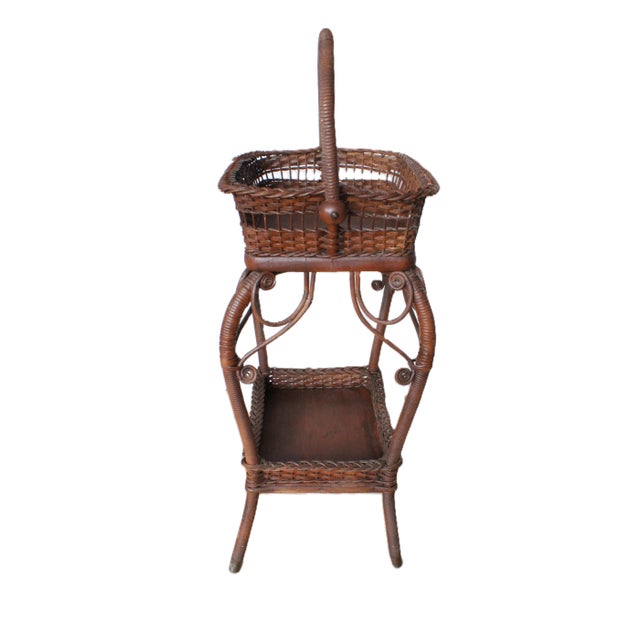 Late 19th century bentwood Victorian wicker sewing stand with unique swing handle. We think this tired stand would by...