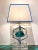 Pair of spectacular Table lights centered by a chiseled emerald green colored crystal in nickel-plated support on an...