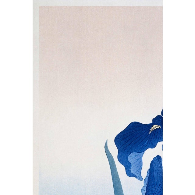A serene example of Japanese woodblock art, this vintage art print reproduction features Blue Iris Flowers, created by...