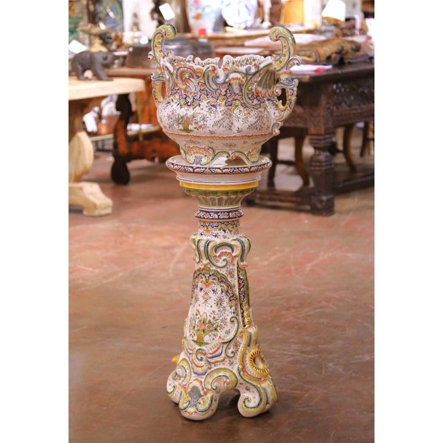 This impressive early 20th century antique French faience jardinière on pedestal, dating to circa 1920, was produced in...