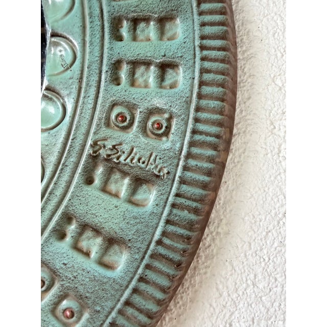 Round ceramic mirror from Italy (signed Silecchia Sassari on the front and back). Graphic motifs around the entire edge,...