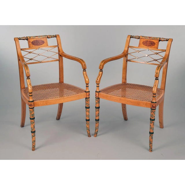 Pair of Edwardian satinwood and painted armchairs with a turned top rail above a rectangular panel enclosing a burr elm...