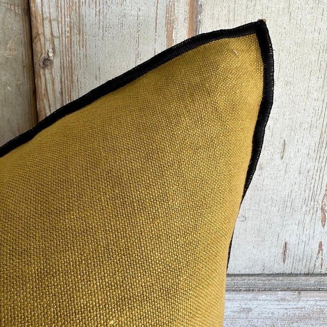 Color: Ocre; a deeper mustard yellow with brown tones, linen textured style pillow with a stitched edge, metal zipper...
