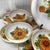Tuscan Mid 20th Century Italian Salad Bowl Set in Glazed Terra Cotta With Orange Floral Design - 9 PCS For Sale - Image 3 of 11