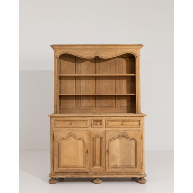 A decorative Louis XV style cupboard featuring elegant curves and refined detailing. The design emphasizes fluidity and...