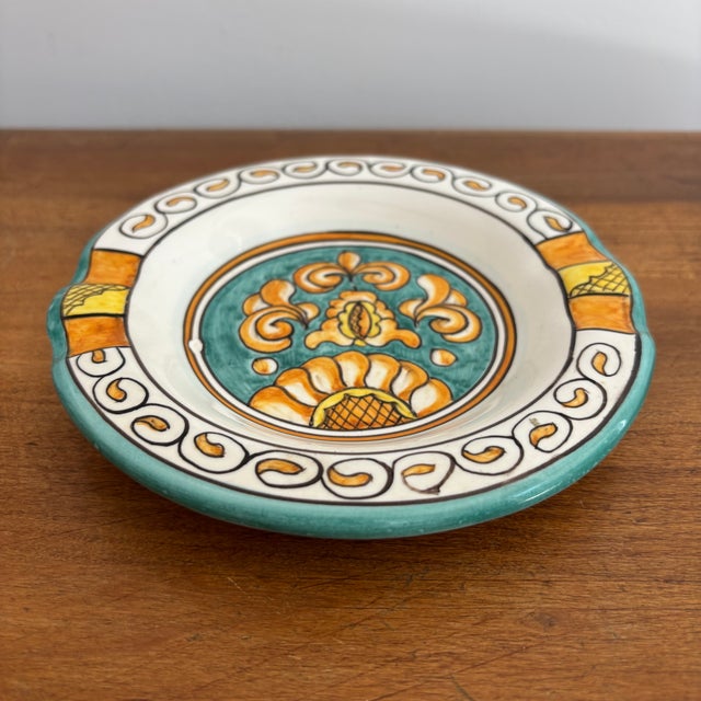 Italian hand-painted ceramic ashtray, traditionally colored in teal, orange, and yellow. Most items found at Pub & Oasis...