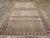 This mid-20th-century Persian Veece accent carpet presents a finely organized geometric composition across a muted blue-...